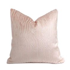 a pink pillow on a white background