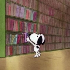 a cartoon dog holding a book in front of a bookshelf full of books