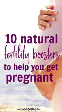 a pregnant woman holding her belly with the words 10 natural fertity boosters to help you get pregnant