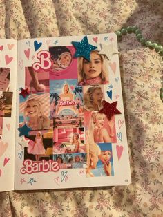 an open book with pictures of barbies on it and hearts all over the pages