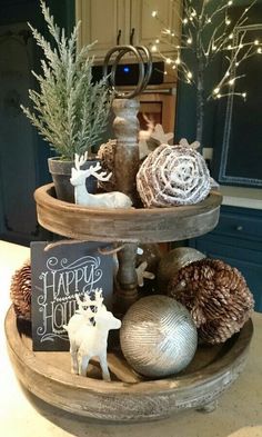 two tiered trays holding christmas decorations