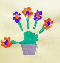 a child's hand painted with flowers in a pot on a piece of paper