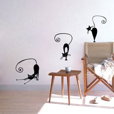 the wall decals are designed to look like cats