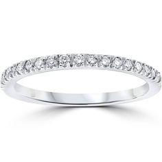 a white gold wedding band with round cut diamonds on the top and bottom, set in 18k white gold