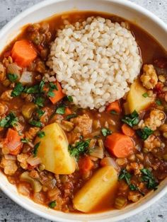 a white bowl filled with stew and rice