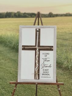 an easel with a cross painted on it