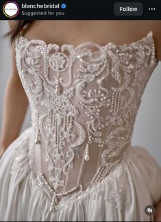 the back of a wedding dress with beading on it