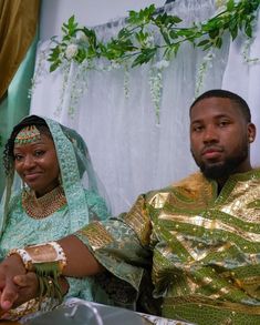 a man and woman sitting next to each other