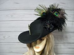 "Perfect hat to top off your pirate ensemble, Black Cavalier woolen hat with black braided trim, black ostrich feathers with three peacock feathers, black cocarde with a pirate skull accent and a removable large rhinestone sword. This hat is 22.5\" for the inside circumference but does have a built-in hat sizer. I'm sorry, I cannot make the inside circumference bigger.  I ship Priority mail. I ship many times a week. If you need your item quicker let me know your zip code and I can figure shippi Black Pirate Costume Hat With Curved Brim, Black Pirate Hat For Festival, Adjustable Black Pirate Costume Hat, Black Adjustable Pirate Hat, Adjustable Black Pirate Hat, Adjustable Black Hat For Larp, Black Adjustable Mini Hats In Fantasy Style, Black Adjustable Fantasy Mini Hat, Steampunk Black Short Brim Costume Hat