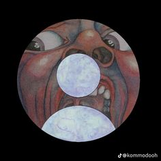 a painting of an evil looking face with two circles in front of it