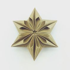 an origami star on a white background