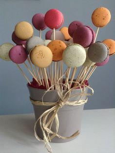 a cup filled with lots of different colored donuts