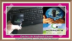 a person holding a small device in their hand next to a keyboard with the earth on it