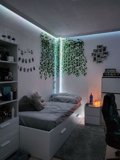 a bed room with a neatly made bed next to a book shelf and a chair