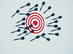 several darts are in the center of a target surrounded by smaller ones on a light blue background