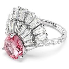 a pink and white diamond ring with an oval cut center surrounded by baguettes