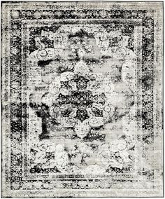 an antique rug with black and white colors