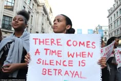 two women holding signs that read there comes a time when science is getraval