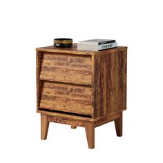 a wooden night stand with two drawers and a book on top of the end table