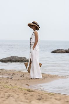 "This Pure Linen wrap pants is simple and stylish. You can adjust the comfortable fit using the ties and inside button Two side pockets 100% linen Match with: https://www.etsy.com/uk/listing/1481459252/minimalist-white-linen-top-linen-tank The white linen fabric is not optical white White linen fabrics are always transparent HEIGHT OF MODEL: 168 cm. / 5′ 6″  Size S All garments are handmade. We accept Returns and Exchange Please provide your PHONE NUMBER for delivery   EXPRESS delivery for ALL ORDERS   Accessories are not for sale. If you have different measurements please inform us. SIZE CHART (measurements of the body NOT of the garment ) XS Bust 82 - 84 cm | 32.28 - 33.07\" Waist 63 - 67 cm | 24.80 - 26.38\" Hips 86 - 90 cm | 33.86 - 35.43\" Inseam 74 cm | 29.13\" Inseam Long 84 cm | 33 Bohemian Linen Wide Leg Pants For Vacation, Summer Linen Beach Pants, Bohemian Linen Pants For Summer, Bohemian Linen Bottoms For Vacation, Summer Beach Linen Wide Leg Pants, Bohemian Linen Vacation Bottoms, Summer Beach Wide Leg Linen Pants, Bohemian High-waisted Wide Leg Pants For Beach, Bohemian Linen Harem Pants For Summer