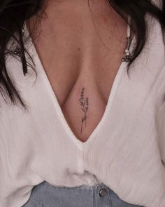 a woman with a tattoo on her chest