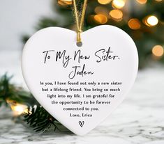 a white heart shaped ornament with a poem written on the front and back