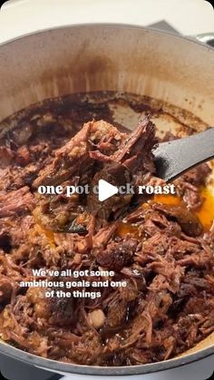 a pot filled with food sitting on top of a stove