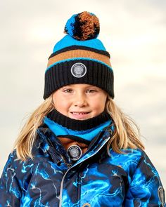 Our Knit Hat Blue, Black and Spice is a must-have on cold weather days. Oh-so-soft in acrylic yarn, this beanie hat features an easy pull-on fit with a cozy lining, a fluffy pompom on top, and a horizontal stripe pattern that makes it easy to mix and match with a variety of different coats and snowsuits. Beanie hat Pompom Logo patch 100% Acrylic - Lining: 94% Polyester, 6% Elastane Fits true to size From 2 years to 14 years Warm Blue Beanie For Winter, Outdoor Blue Knitted Beanie, Blue Winter Beanie For Outdoor Use, Blue Winter Beanie For Outdoor, Blue Winter Hats For Cold Weather, Blue Warm Beanie For Cold Weather, Blue Winter Outdoor Beanie, Blue Winter Outdoor Hat, Blue Hats For Outdoor Fall Activities