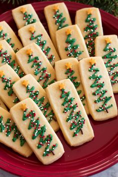 christmas tree shaped cookies on a red plate