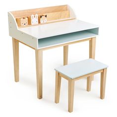 a child's desk and bench with toy animals