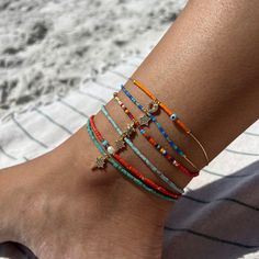 "Beaded Beach Anklet, Boho Ankle Bracelet, Festival Anklet, Bead Chain Anklet, Summer Ankle Bracelet, Seed Bead Anklet, Assorted Bead Boho Anklets, Seed Bead Anklet, Beach Ankle Bracelet, African Beaded Bracelet, Summer Rainbow Anklet, Surfer Anklet, Stackable Anklet Color, Bead Chain Anklet, LISTING is for a single anklet design. ● Material: Seed Bead, Glass Beads, gold plated chain ● Length: 8.5 - 10 \", it is adjustable with an extender Bohemian anklets are perfect for daily use, especially in summer. Beaded Beach Anklet is made by using seed glass beads and a fine gold chain and clasps. Minimalist boho anklet is the perfect choice for summer, beach time, or anytime you want. Rainbow seed beads and gold chain combination looks charming. Summer Anklet has an extra chain to adjust. You ca Strand Anklets With Tiny Beads For Gifts, Beaded Strand Anklet For Gift, Gift Strand Anklets With Tiny Beads, Beaded Strand Anklet As Gift, Tiny Beads Strand Anklet For Gift, Letter Beads Round Anklets As Gift, Seed Bead Shoe Anklet, Summer Festival Beaded Anklets, Casual Colorful Beaded Anklets As Gift