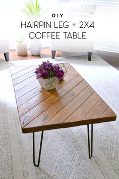 the table is made from wood and has hairpin legs on each side, with a basket of flowers on top