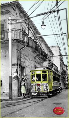 an old photo of a trolley on the street