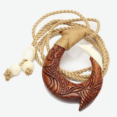 a wooden necklace with an anchor and rope