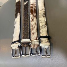 Step up your style with our premium cowhide leather belt. Handcrafted from the finest materials, each hair on belt is designed to last and keep you looking your best. Find the perfect cow skin belt fit for any occasion with our range of sizes. FEATURES: - Timeless, elegant cowhide belt designs crafted with only the finest materials. - Meticulous attention to detail and craftsmanship for superior quality. - Breathe life into any outfit with these stylish hair on belts. - Make a statement with stylish and sophisticated pieces of art that will never go out of style. - Durable materials and reliable construction that ensures lasting quality of cow skin belts. DISCLAIMER: We use only eco-friendly cleaning systems to tan and clean our products.  NO ANIMALS ARE HARMED as cow skins are specificall Sacs Tote Bags, Handmade Leather Belt, Cow Skin, Real Hair, Belt Design, Mode Inspo, Stylish Hair, Instagram Foto, Leather Belts