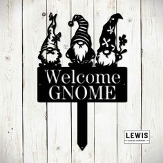 welcome gnome sign on a wooden wall