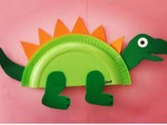 a paper plate shaped like a dinosaur