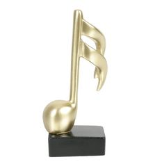 a gold musical note on a black stand