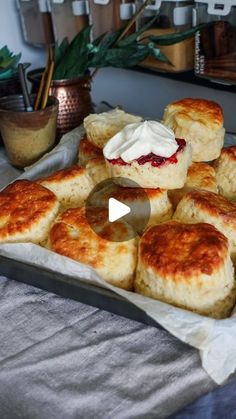 there are many biscuits on the table with cream