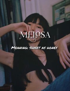 a woman sitting on top of a couch next to a window with the words melosa meaning sweet as honey