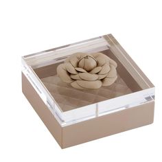 a square shaped object with a flower on it's side in a clear box