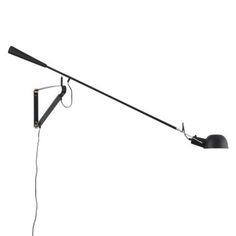 a black lamp with a long arm and two lights on each end, one light is turned on the other side