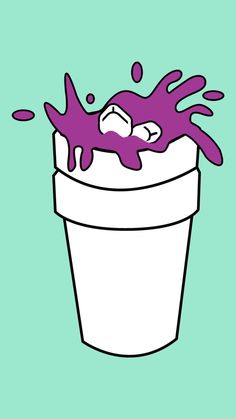 a cup filled with purple liquid on top of a green background and the bottom is white