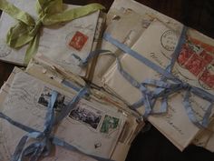 several old envelopes with ribbons tied around them