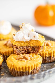 pumpkin pie cupcakes with whipped cream on top