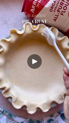 a person holding a plastic fork over a pie pan