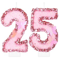 the number 25 candle has pink glitter on it