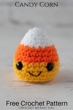 a small crocheted toy with an orange and white hat on it