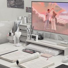 a desktop computer sitting on top of a white desk