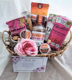 a basket filled with lots of different types of food and snacks on top of a table